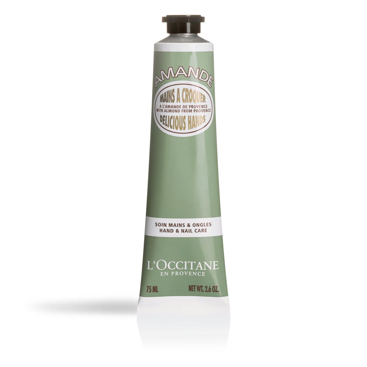 Grüne Tube mit Mandel-Handcreme. Text: AMANDE, MAINS A CROQUER, DELICIOUS HANDS, SOIN MAINS & ONGLES, L'OCCITANE. 75 ml, Net Wt. 2.6 oz.