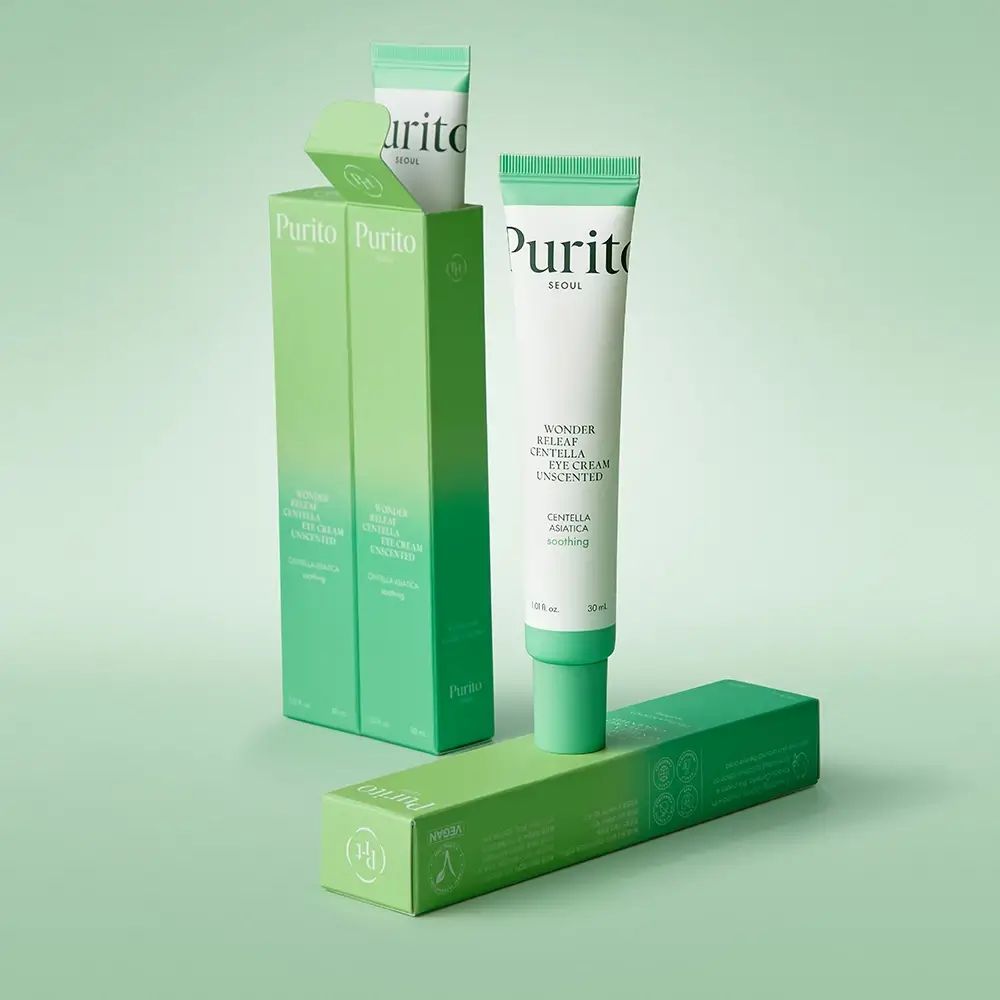 Produktverpackung mit Tuben und Schachteln. Die Tube ist weiß mit grünen Akzenten. Der Text lautet: PURITO Wonder Releaf Centella Unscented Eye Cream.
