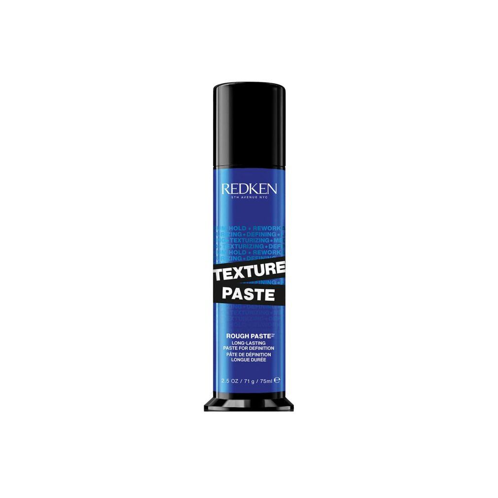 Zylinderförmige Tube. Schwarzer Deckel, blauer Körper mit weißer Schrift. "Redken" und "Texture Paste" deutlich sichtbar.