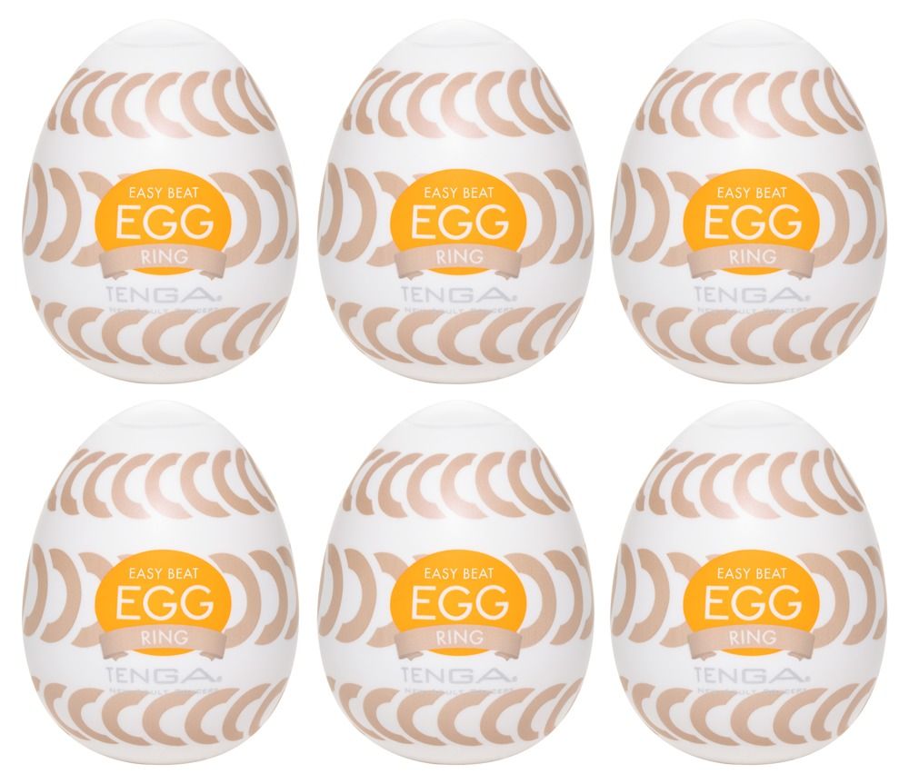 Sechs weiße, ovale Produkte mit braunen Halbkreisen und orangefarbenem Aufkleber. Text: EASY BEAT EGG RING, TENGA.