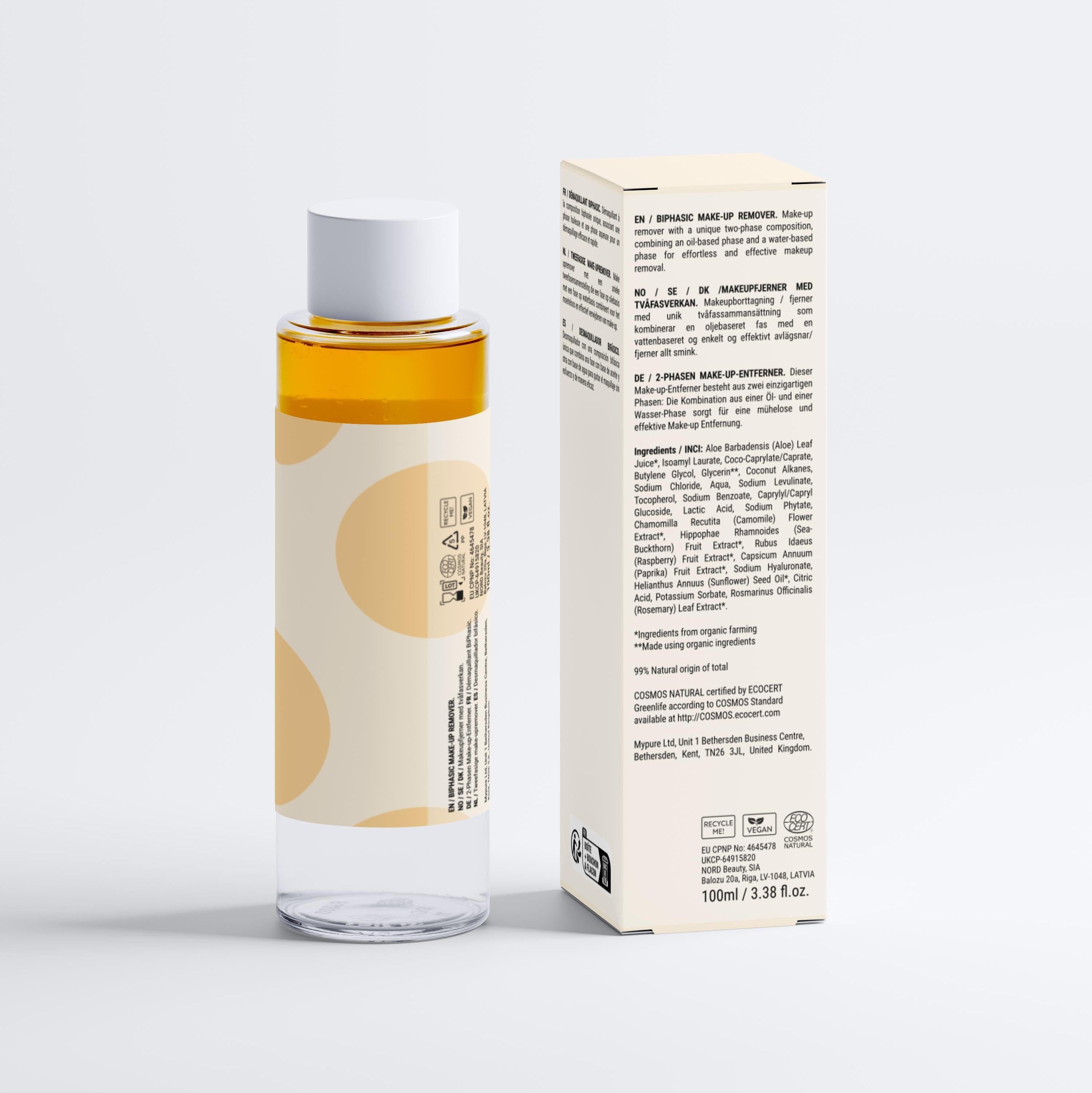 Zwei-Phasen-Make-up-Entferner in klarer Flasche mit gelber Flüssigkeit und weißem Deckel. Beigefügte Verpackung mit Text.