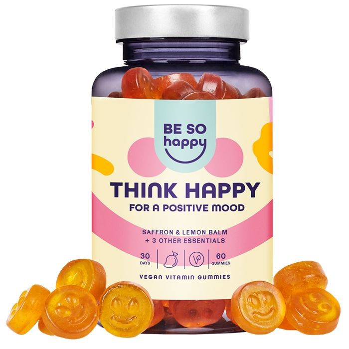 Eine Flasche mit gelben, smileyförmigen Gummibärchen. Auf dem Etikett steht "BE SO happy THINK HAPPY" und "Für eine positive Stimmung".