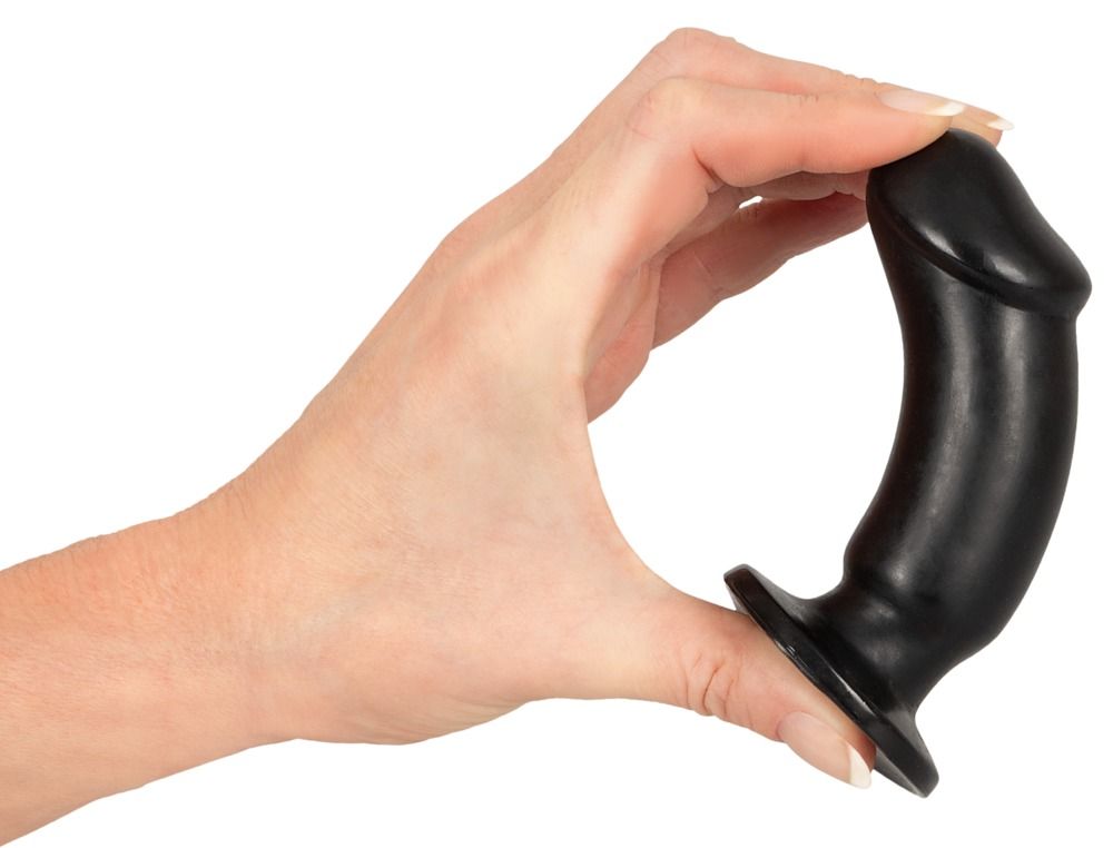 Eine Hand hält einen schwarzen Analplug. Die Form ist zylindrisch mit einer abgerundeten Spitze und einem breiten Sockel.