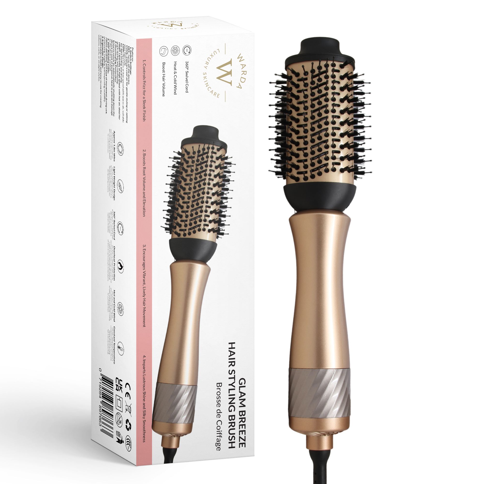 Haarstylingbürste mit goldfarbenem Griff und schwarzem Bürstenkopf. Steht neben der Verpackung.