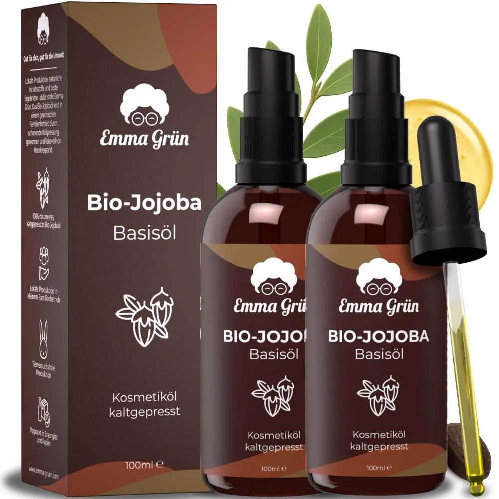 Zwei braune Flaschen mit schwarzem Pumpaufsatz und Karton. Aufschrift: Emma Grün Bio-Jojoba Basisöl. Kaltgepresst. Mit Tropfer.