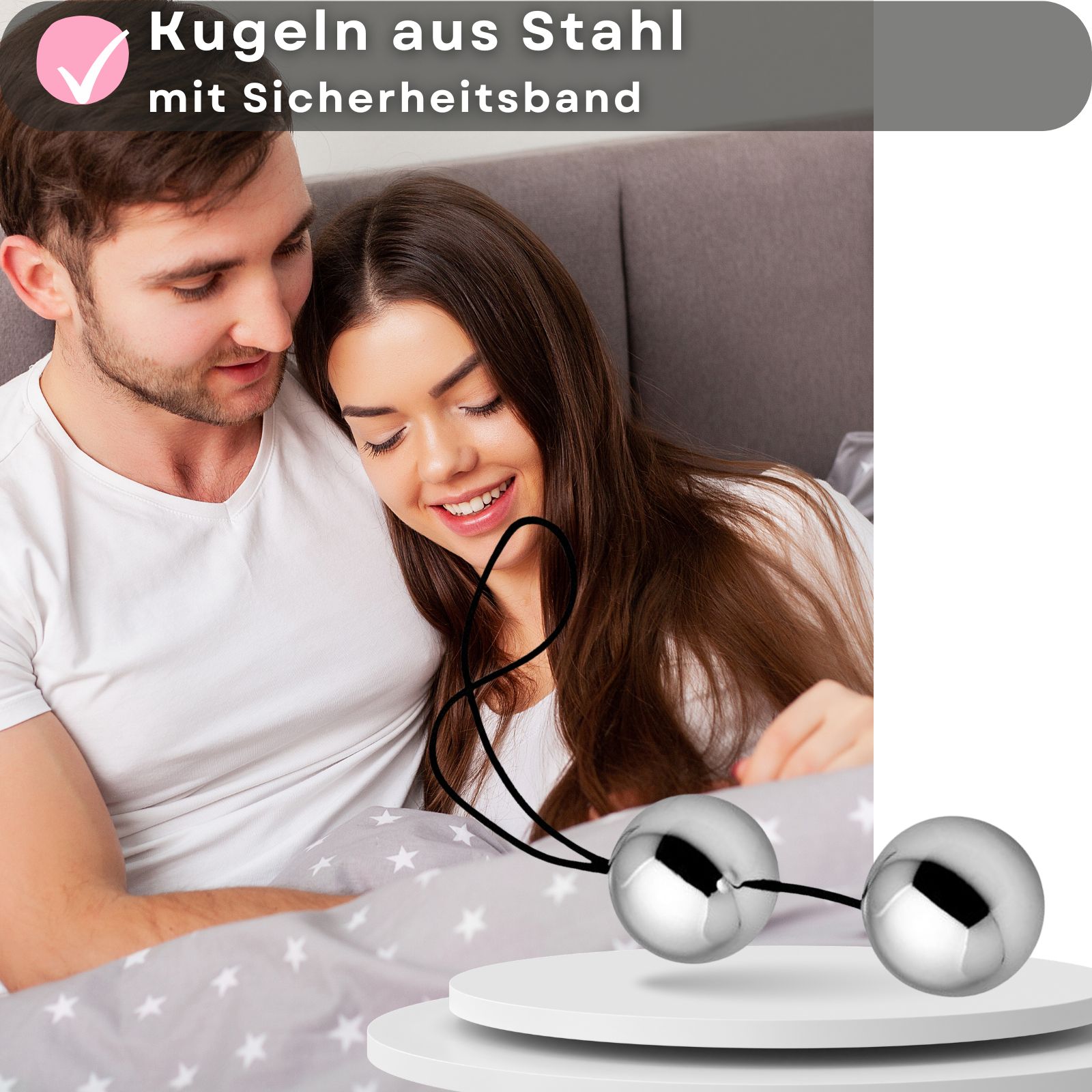 Zwei polierte Stahlkugeln mit Sicherheitsband in einer Hand.