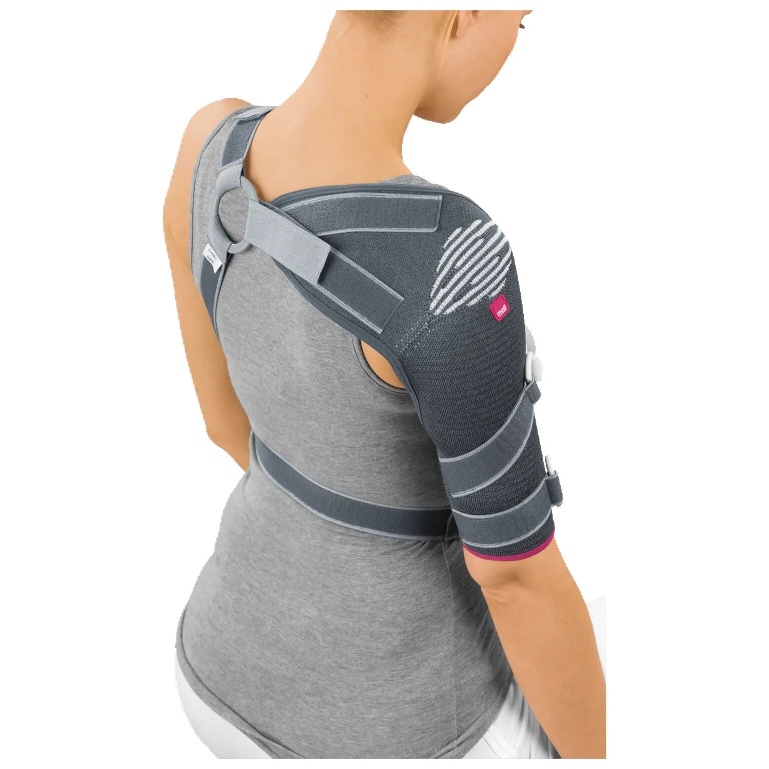 Schultergelenkbandage, grau-schwarz. Mit Gurten, Klettverschlüssen und D-Ringen. Auf einer Person getragen.