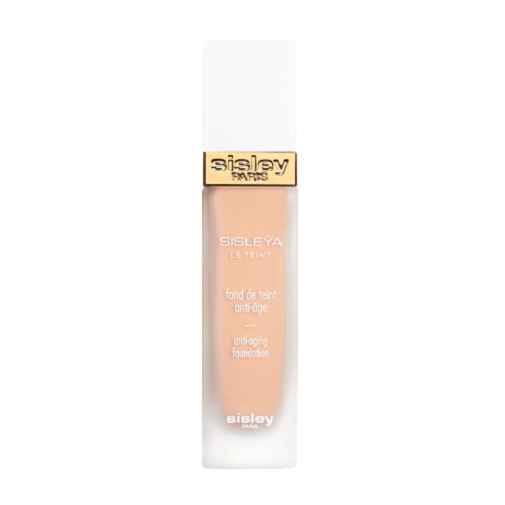 Sisley Le Teint Anti-Âge Foundation. Flakon mit weißem Deckel und goldfarbenem Schriftzug. Produktname und Text auf dem Flakon.