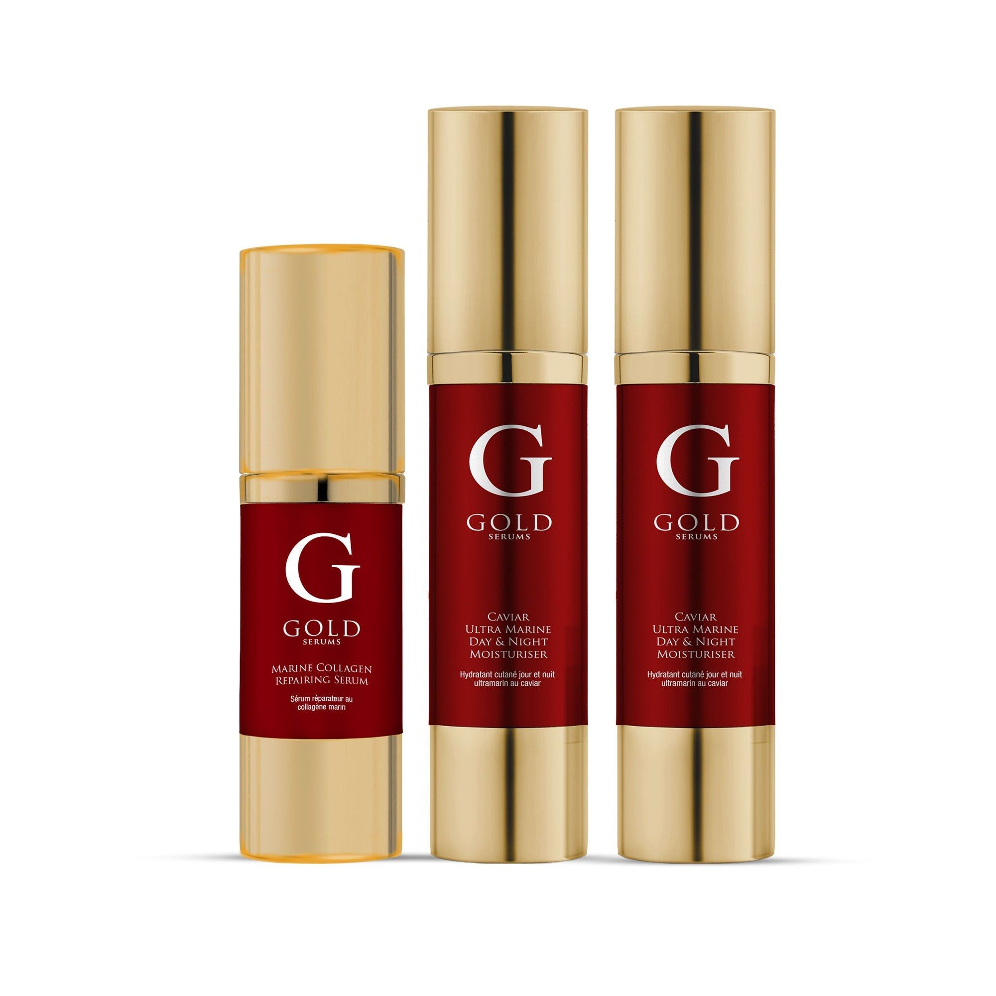 Drei goldfarbene Flakons mit roter Beschriftung. Aufschrift: "G GOLD SERUMS".