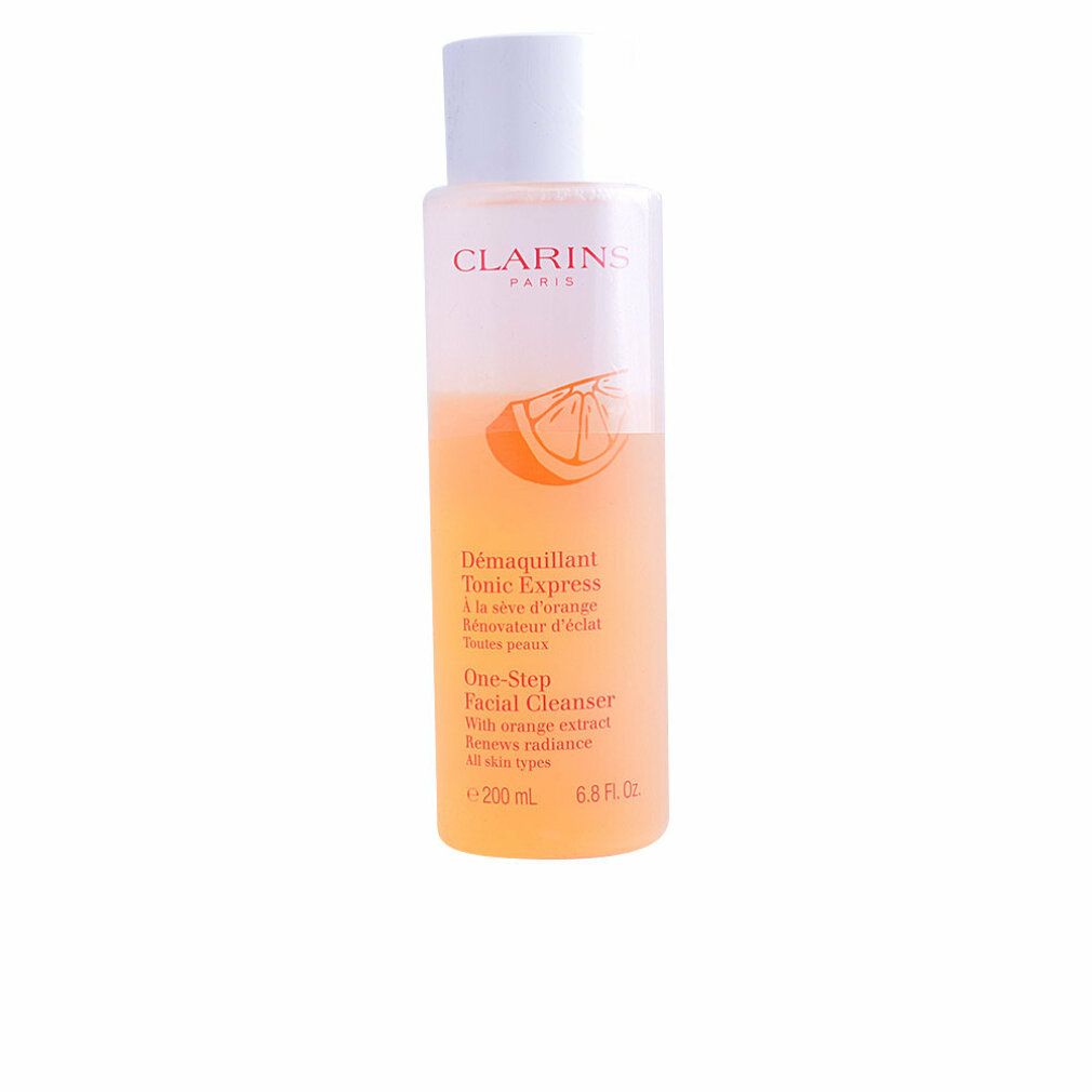 Clarins One-Step Facial Cleanser. Flasche mit orangefarbener Flüssigkeit. Aufschrift: Clarins Paris, Tonic Express, One-Step Facial Cleanser.