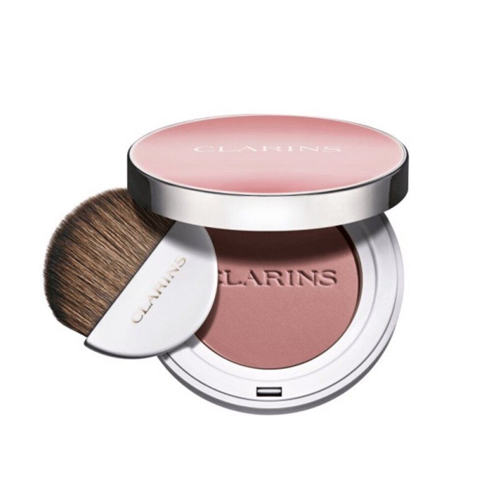 Runder Rouge-Kompaktpuder mit Pinsel. Deckel mit Schriftzug CLARINS. Puder in Rosa. Pinsel mit weißem Griff. Aufschrift CLARINS.