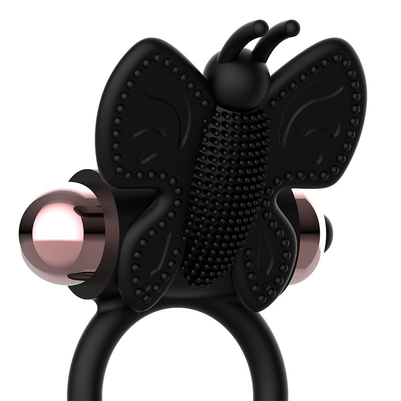 Schwarzer Vibrationsring mit Schmetterlingsdesign und rosegoldfarbenen Elementen.