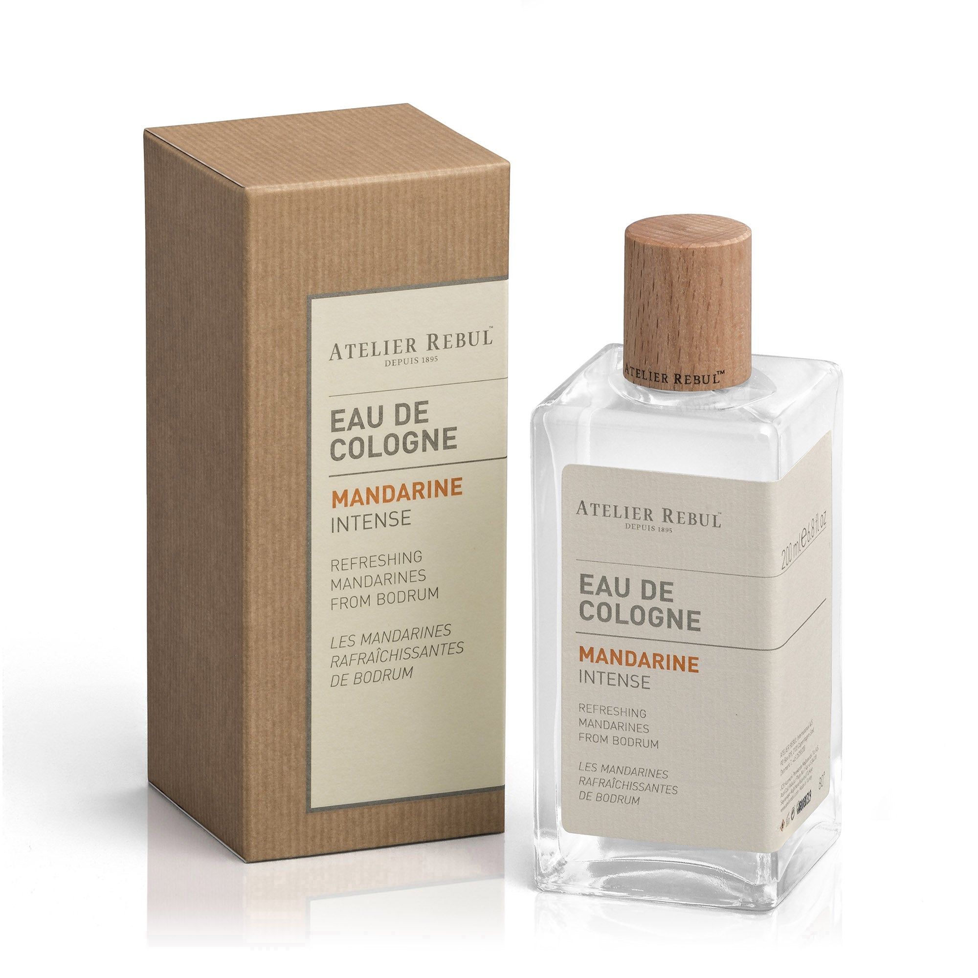 Eau de Cologne Flasche neben einer braunen Schachtel. Aufschrift: Atelier Rebul Eau de Cologne Mandarine Intense.