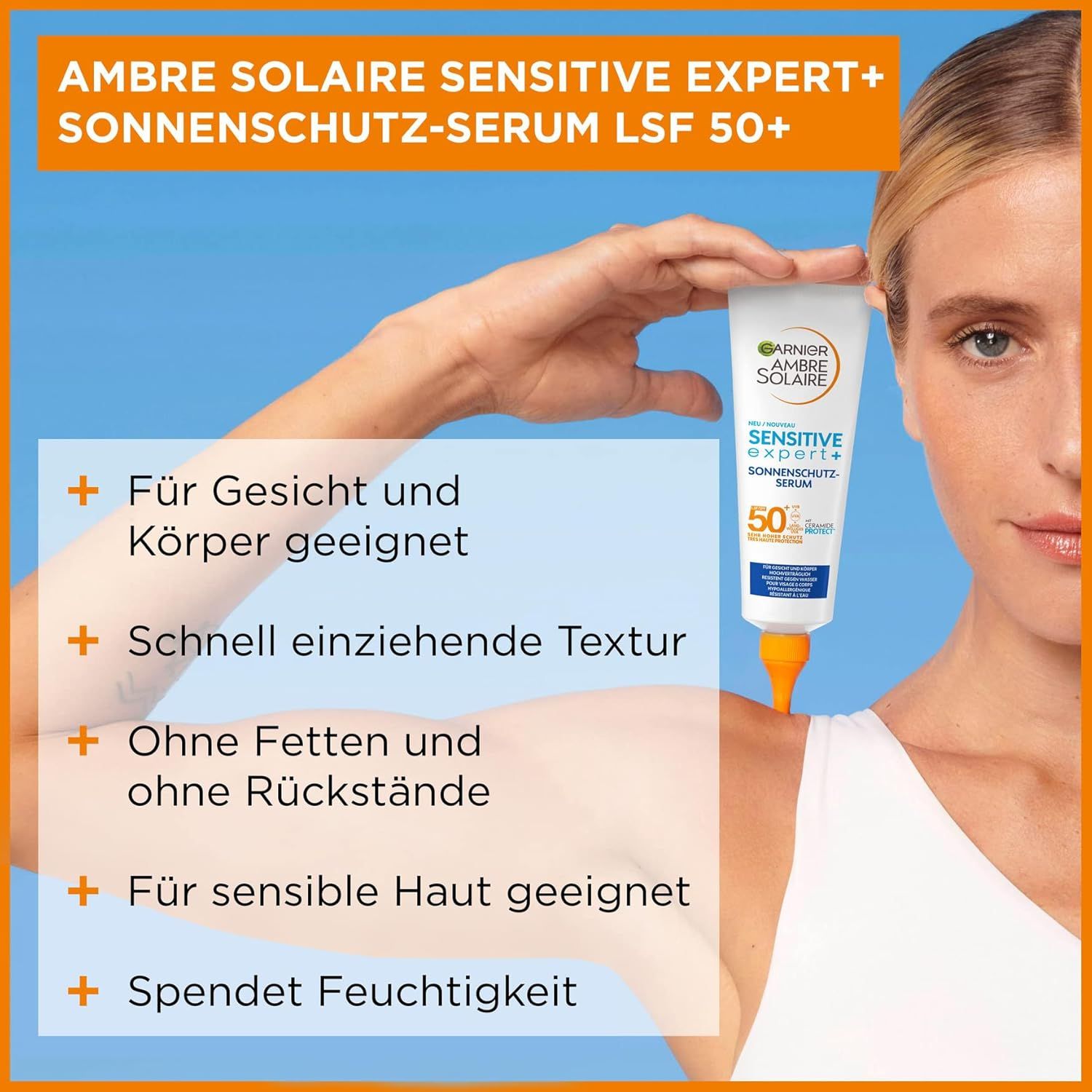 Frau hält Tube Garnier Ambre Solaire Sensitive Expert+ LSF50+ Sonnen-Serum. Produkt- und Text-Elemente.