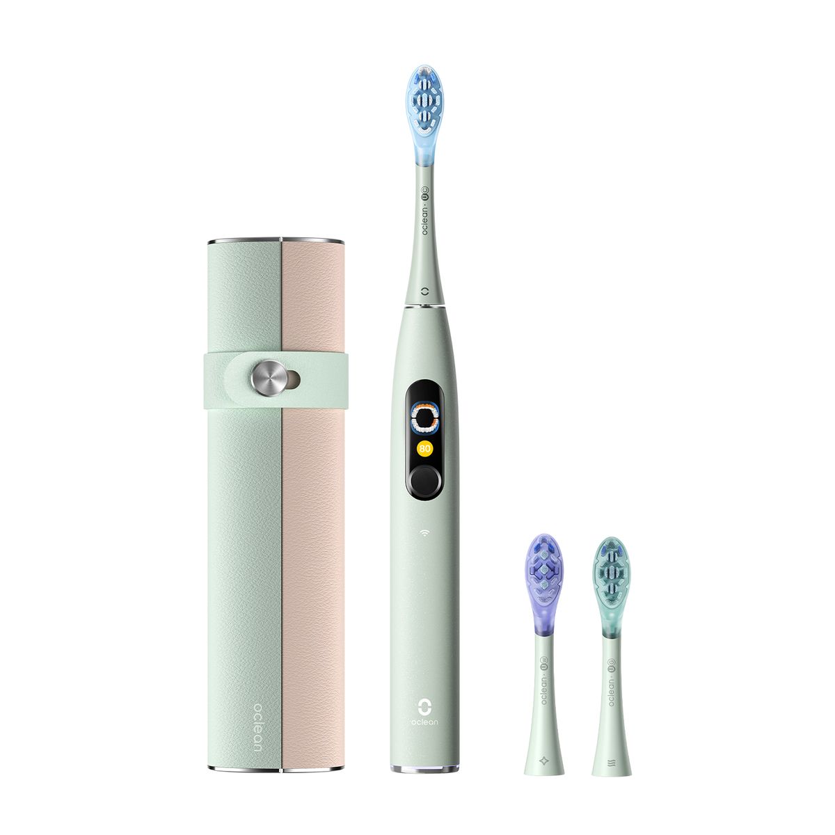 Grüne elektrische Zahnbürste mit zwei Ersatzbürsten und Etui. Produktname auf dem Etui.