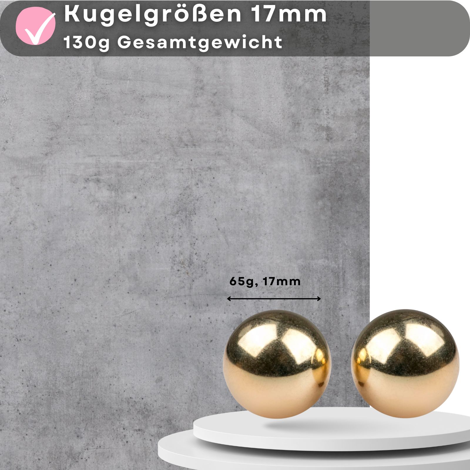 Zwei goldfarbene Kugeln. Metall. 65g, 17mm. Auf Podest.