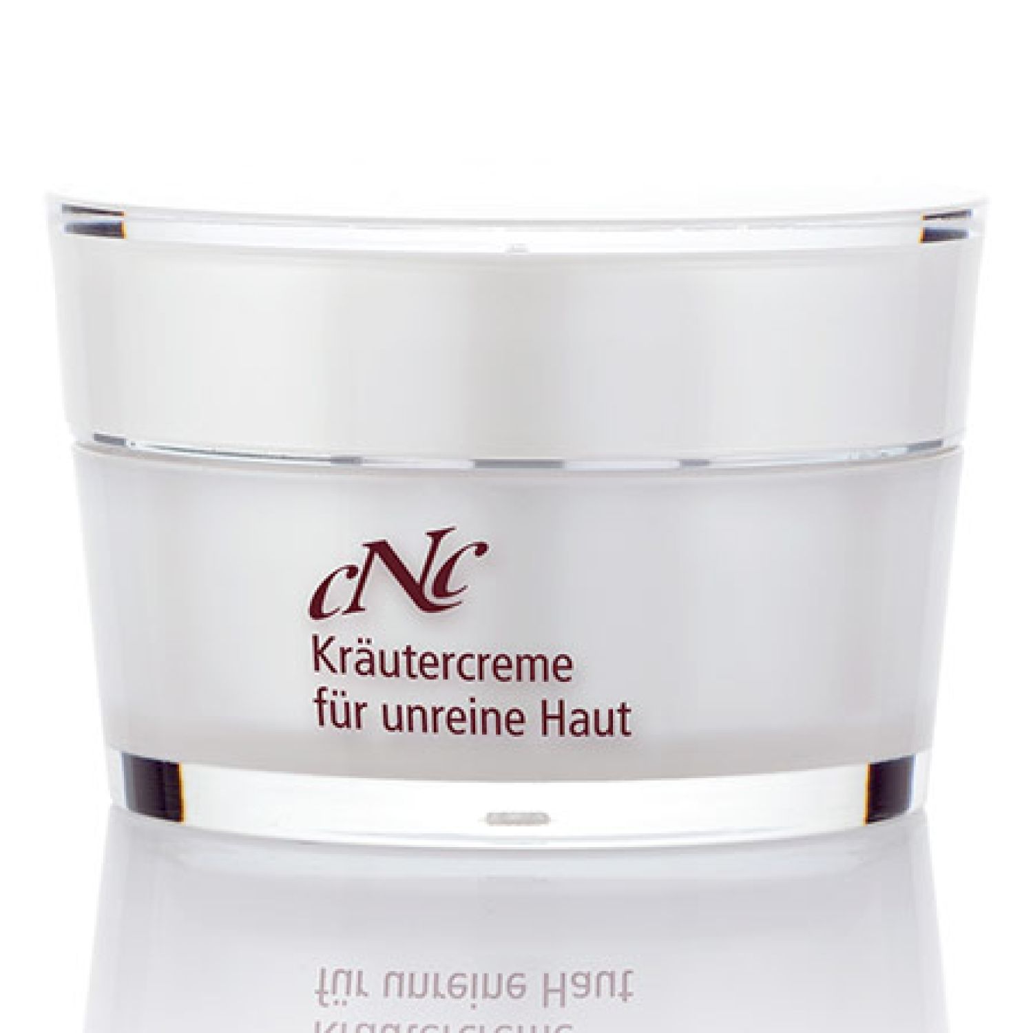 Creme-Tiegel mit Deckel. Aufschrift: CNC Kräutercreme für unreine Haut.