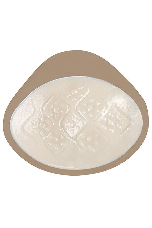 Brustepithese, beige. Innenseite mit wellenförmiger Struktur. Ovale Form.