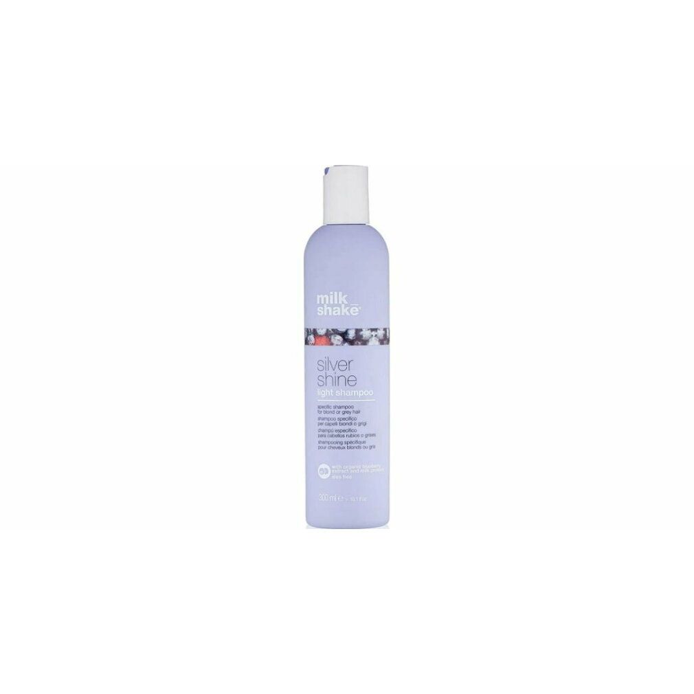 Lila Shampoo-Flasche mit weißem Deckel. Aufschrift: milk_shake, Silver Shine light shampoo. 250 ml.