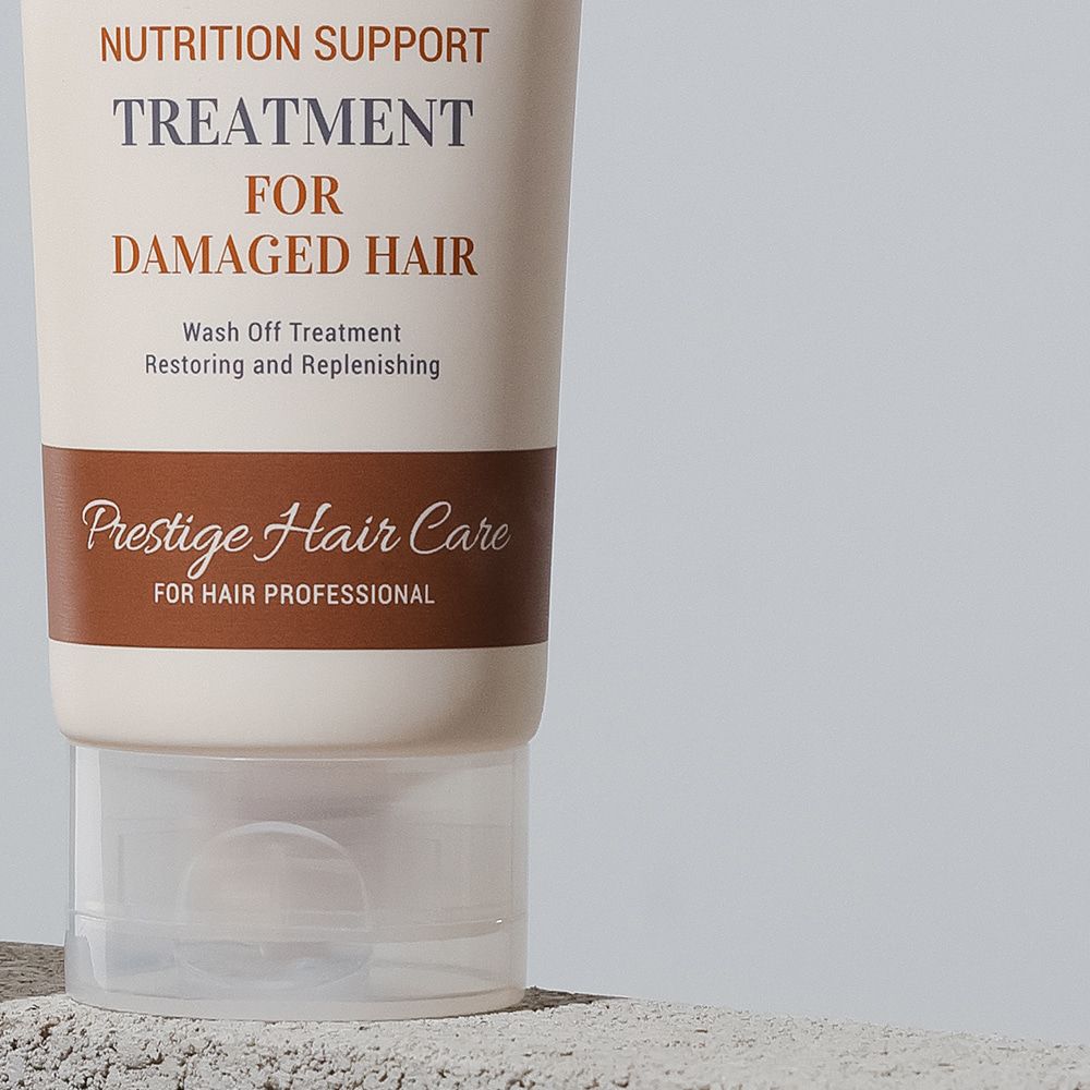 Ausschnitt des Produkts. Aufschrift: Nutrition Support Treatment for Damaged Hair, Prestige Hair Care.