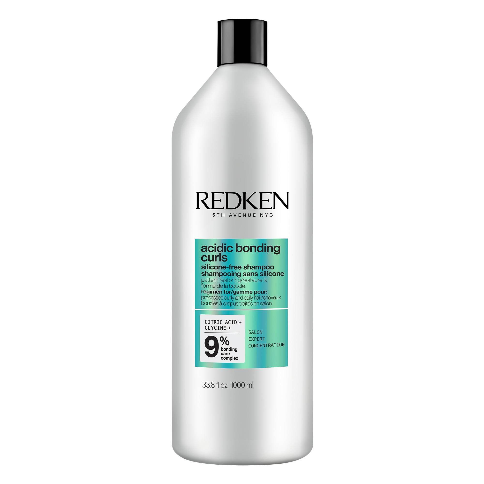Silikonfreies Shampoo in einer weißen Flasche mit schwarzem Deckel. Aufschrift: REDKEN, acidic bonding curls.