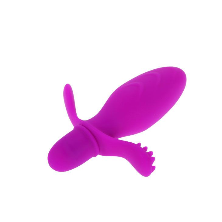 Lila Vibrator mit Flügeln und Noppen. Aus Silikon. Oben abgerundet, unten zylindrisch.