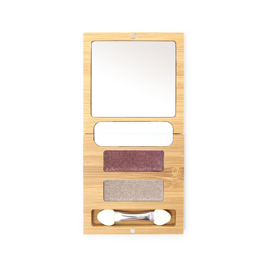 Geöffnete Bambus-Box Duo mit Spiegel, zwei Lidschattenfarben und Applikator. Die Farben sind Lila und Beige.