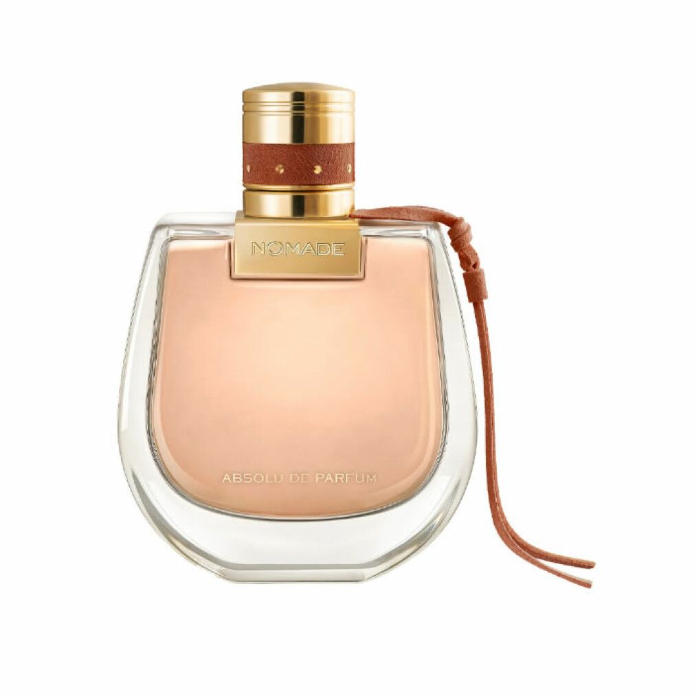 Parfümflakon mit goldfarbenem Deckel, braunem Lederband. Aufschrift 'Nomade Absolu de Parfum'. Transparenter Flakon.