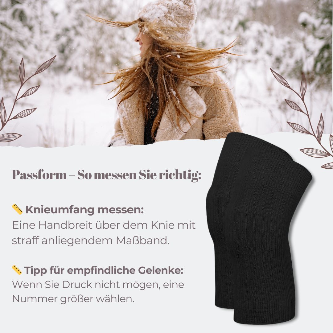 Schwarze Angora-Kniewärmer. Geripptes Material. Hintergrund: verschneite Landschaft mit Person.