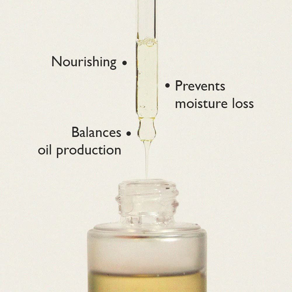 Nahaufnahme einer Pipette, die Öl in eine Flasche tropft. Text: Nährt, gleicht die Ölproduktion aus, verhindert Feuchtigkeitsverlust.