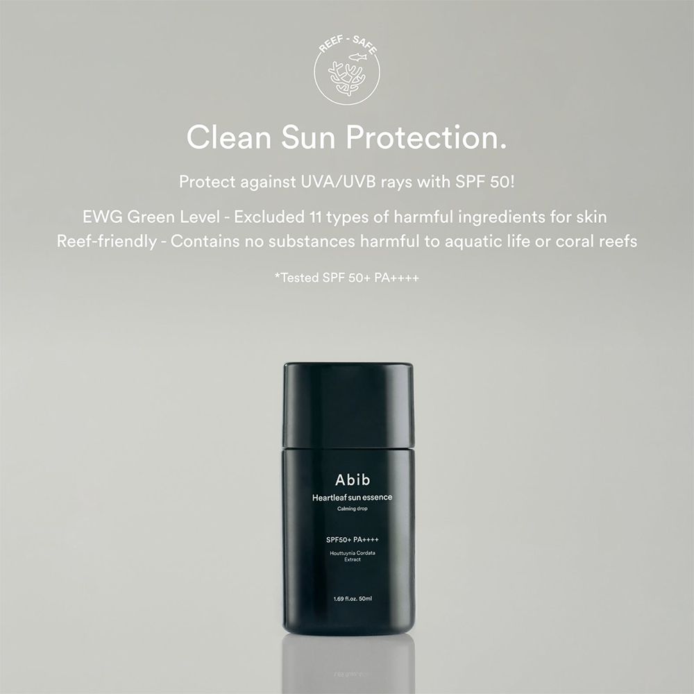 Schwarze Flasche mit weißer Schrift: Abib Heartleaf Sun Essence, SPF50+ PA++++.  Reef-safe.