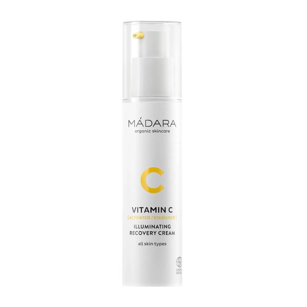 Weiße Flasche mit Spender. Gelber Aufdruck: Vitamin C, Illuminating Recovery Creme. Marke: MÁDARA.
