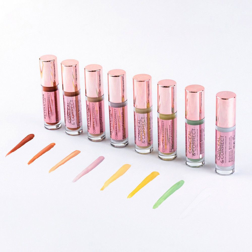Mehrere flüssige Concealer in Fläschchen mit roségoldenen Deckeln und Farbproben.