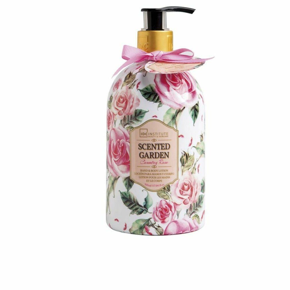 Flasche mit Rosenmuster und Dosierpumpe. Aufschrift: Scented Garden, Rose. Rosa Schleife und Anhänger.