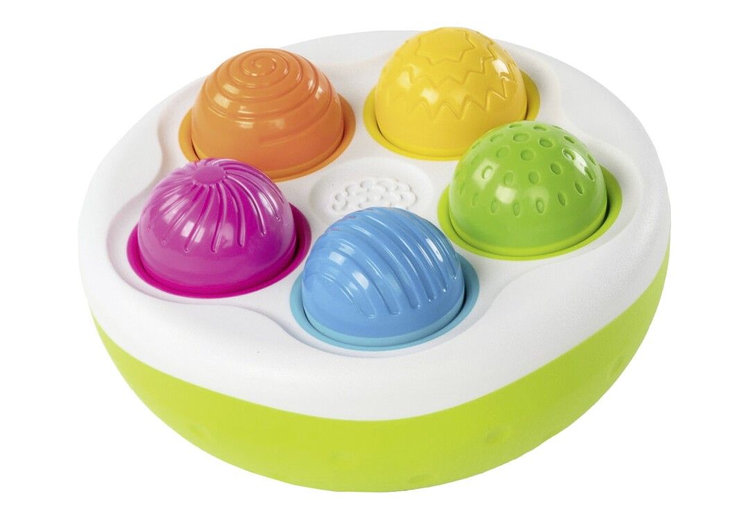 Rundes, grünes Spielzeug mit fünf farbigen, halbkugelförmigen Elementen. Weißer Rand. Elemente: orange, gelb, grün, pink, blau.