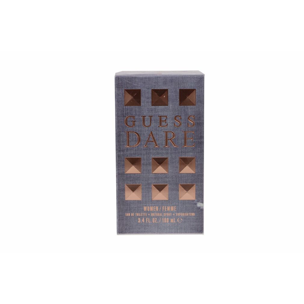 Rechteckige Schachtel mit Aufschrift GUESS DARE. Goldfarbene quadratische Verzierungen. Text: WOMEN / FEMME.