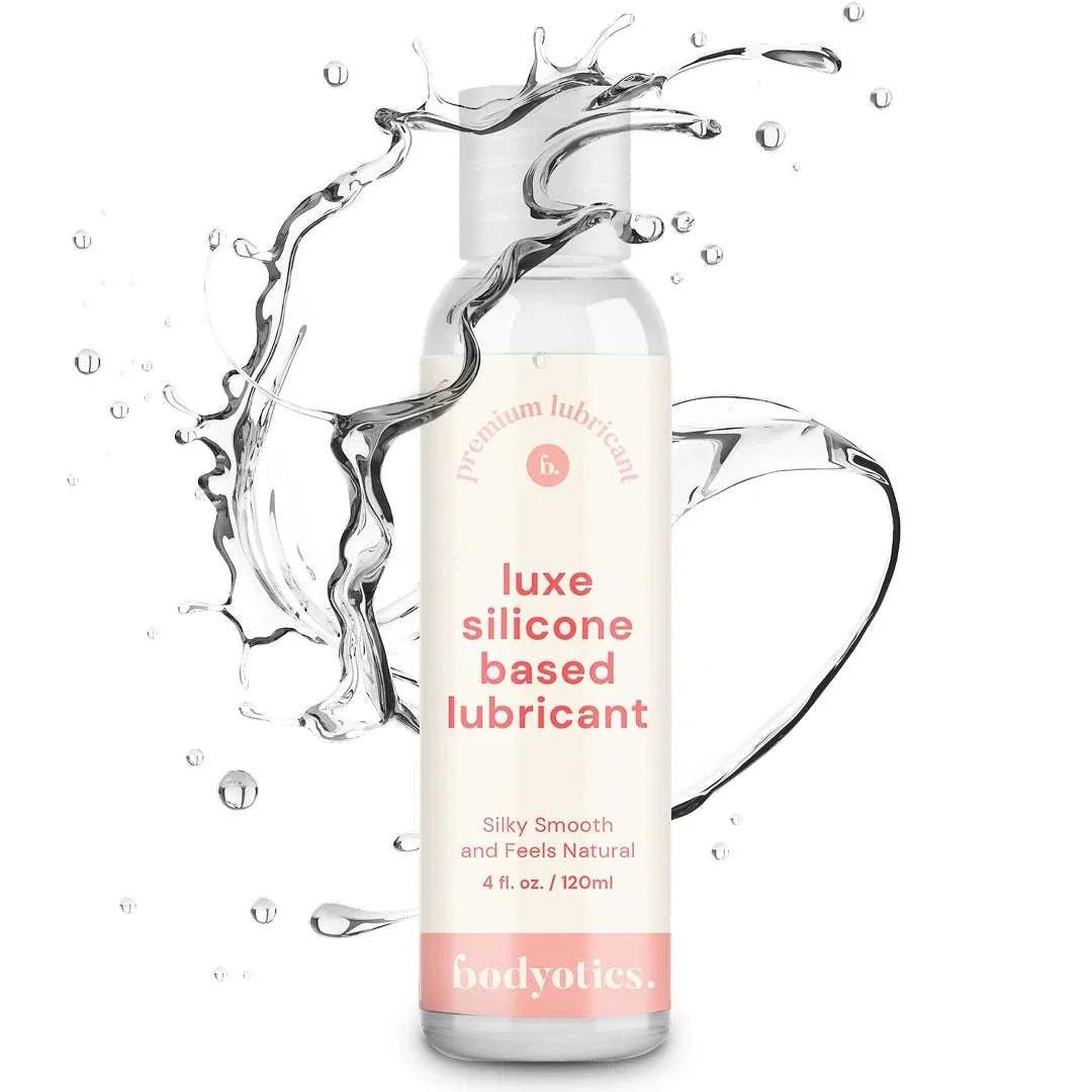 Transparente Flasche mit weißem Deckel. Aufschrift: "luxe silicone based lubricant". Darunter: "bodyotics."
