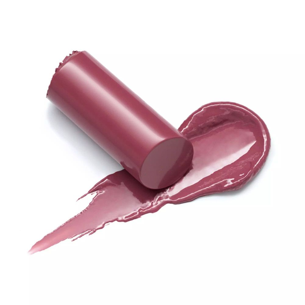 Lippenstift-Stift und Abstrich. Farbe: Rosa. Stift liegt neben dem Abstrich.