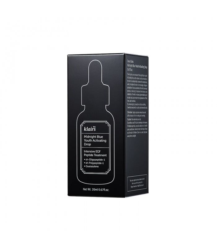 Schwarze Schachtel mit Produktabbildung und Text. Auf der Schachtel steht "Midnight Blue Youth Activating Drop".