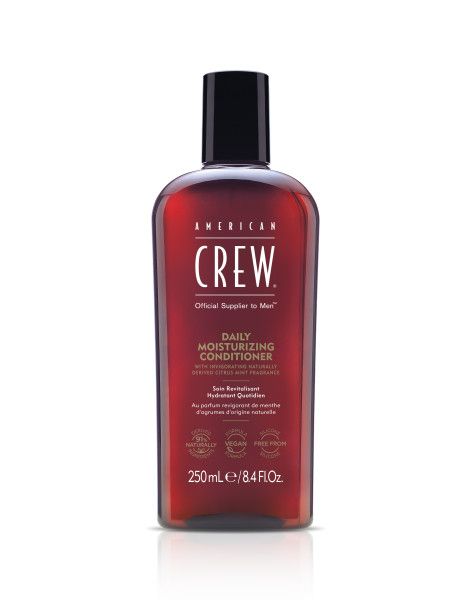 Rote Flasche mit schwarzem Deckel. Aufschrift: AMERICAN CREW Daily Moisturizing Conditioner. 250ml/8.4 fl.oz.