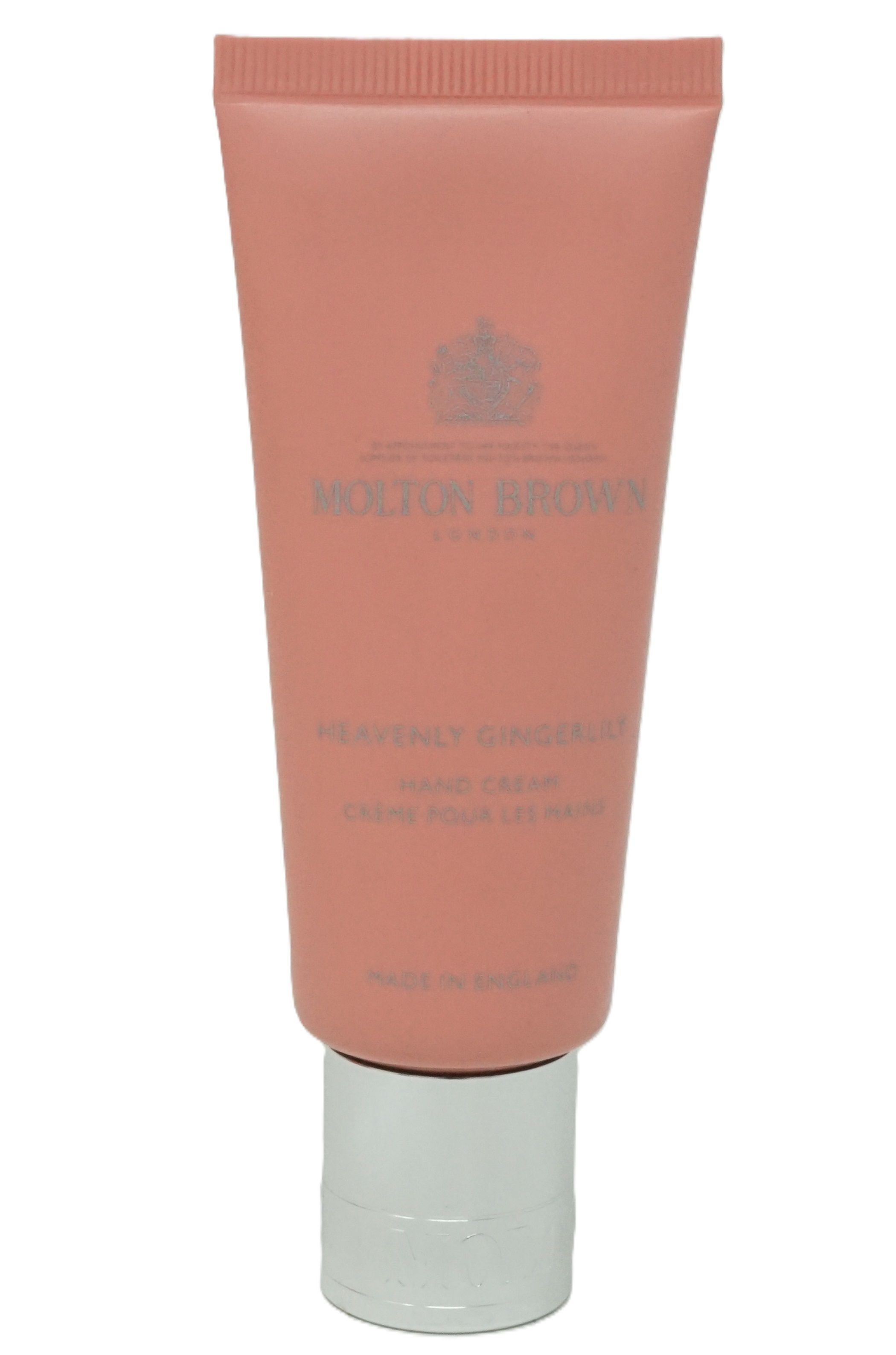 Rosa Tube mit silberner Kappe. Aufschrift: Molton Brown, Heavenly Gingerlily Hand Creme.