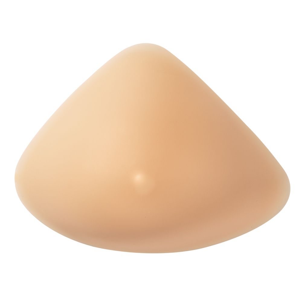 Brustprothese, volle Brustform, hautfarben. Dreieckige Form mit abgerundeten Kanten. Kleine Erhebung auf der Oberfläche.