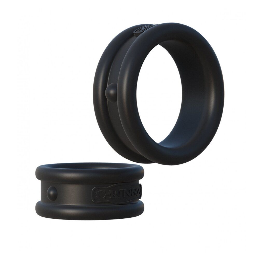 Zwei schwarze Penisringe aus Silikon. Ein Ring hat eine Doppelring-Form, der andere ist flach.