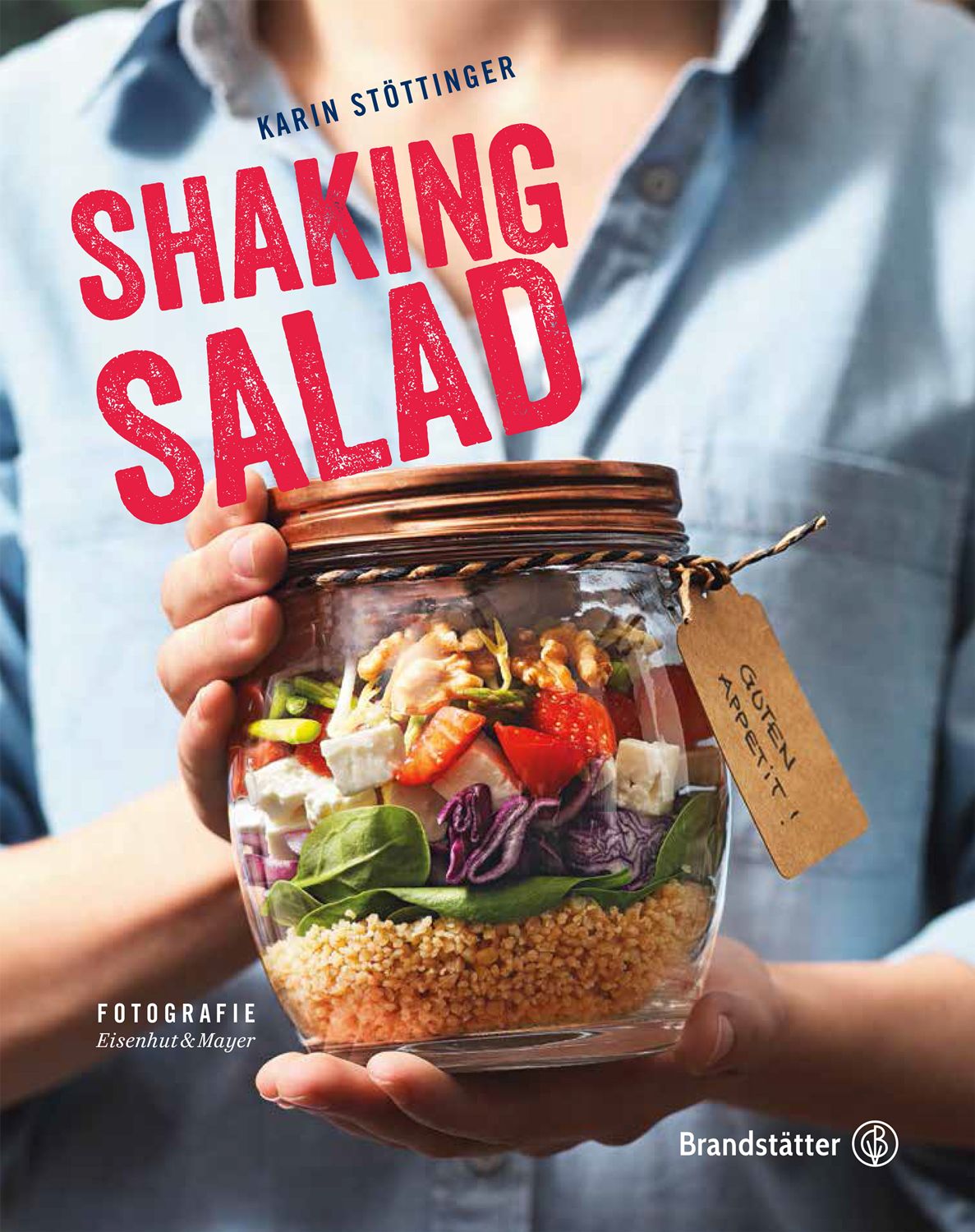 Buchcover mit Titel "Shaking Salad". Hände halten ein Glas mit Salat. Auf dem Etikett steht "Guten Appetit!".