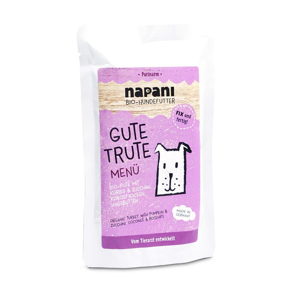 Hundefutterbeutel mit lila Etikett. Aufschrift: Gute Trute Menü. Enthält Bio-Pute, Kürbis, Zucchini, Kokosflocken, Hagebutten. Marke: napani.