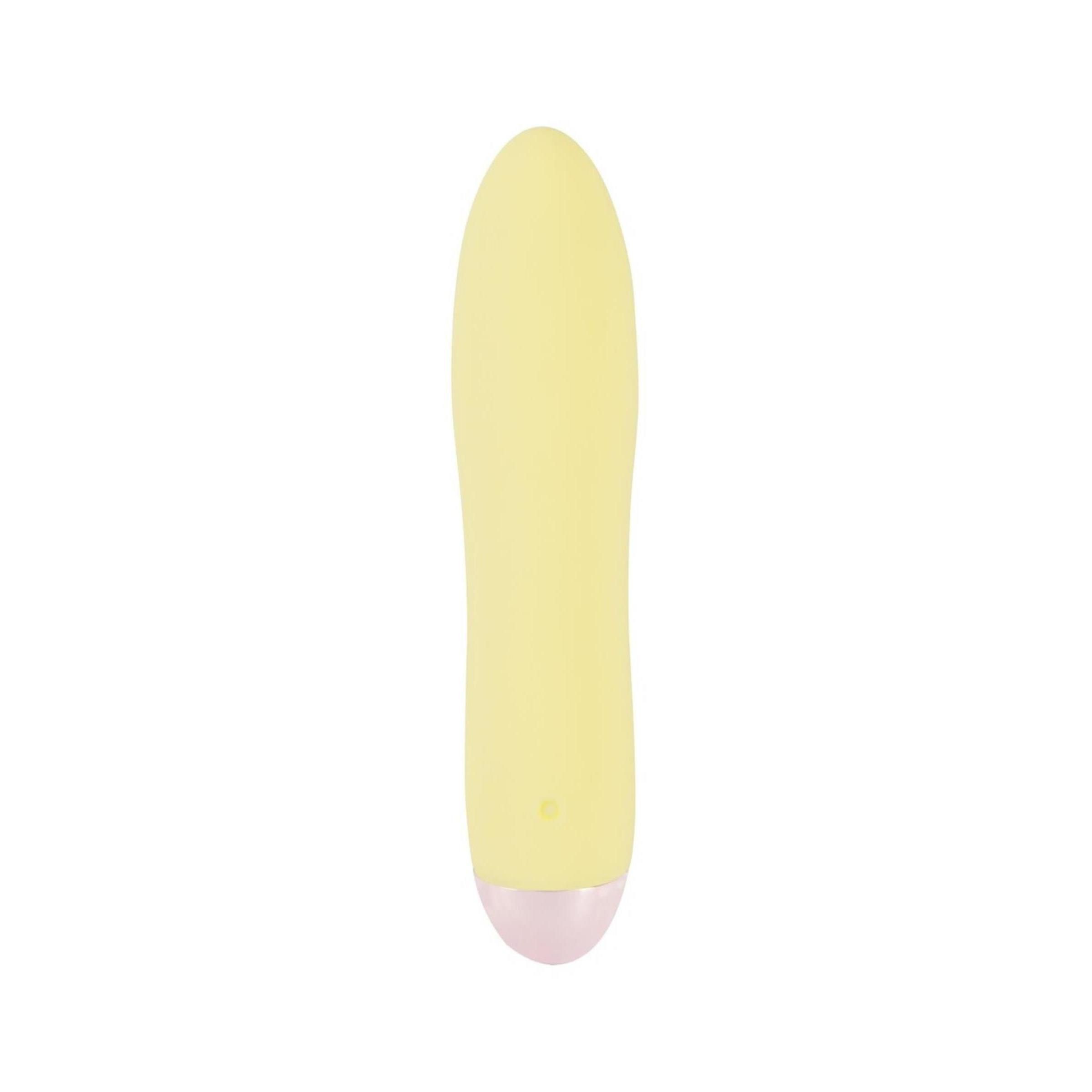 Gelber Vibrator mit rosa Spitze. Glatte Oberfläche, längliche Form.