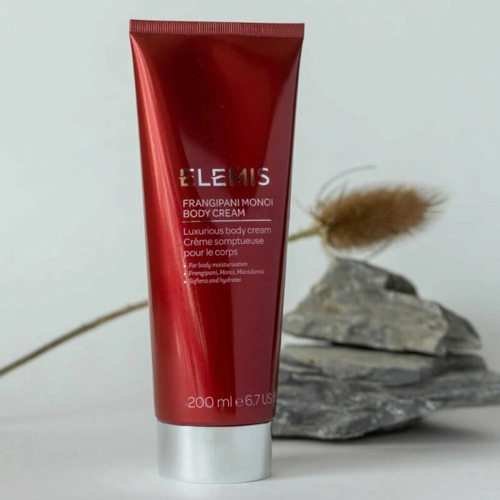 Rote Tube mit Produktaufschrift. Elemis Frangipani Monoi Body Cream. 200 ml. Aufschrift: Luxurious body cream.