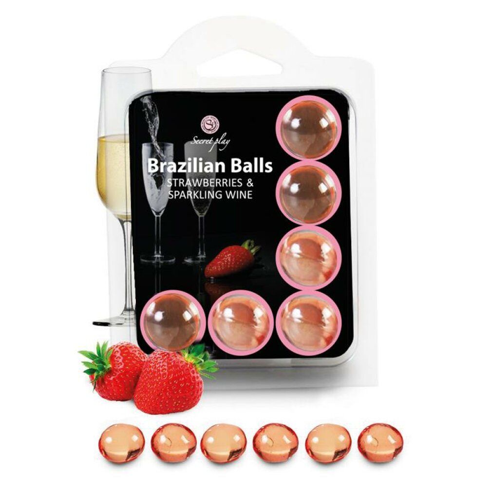 Blisterpackung mit sechs brasilianischen Kugeln. Erdbeer- und Sekt-Motiv. Transparente Kugeln in rosa Verpackung.