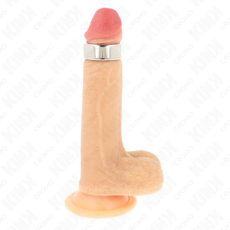 Dildo mit Metallring. Hautfarbenes Material, rosa Spitze. Basis mit Saugnapf. Kink-Logo im Hintergrund.