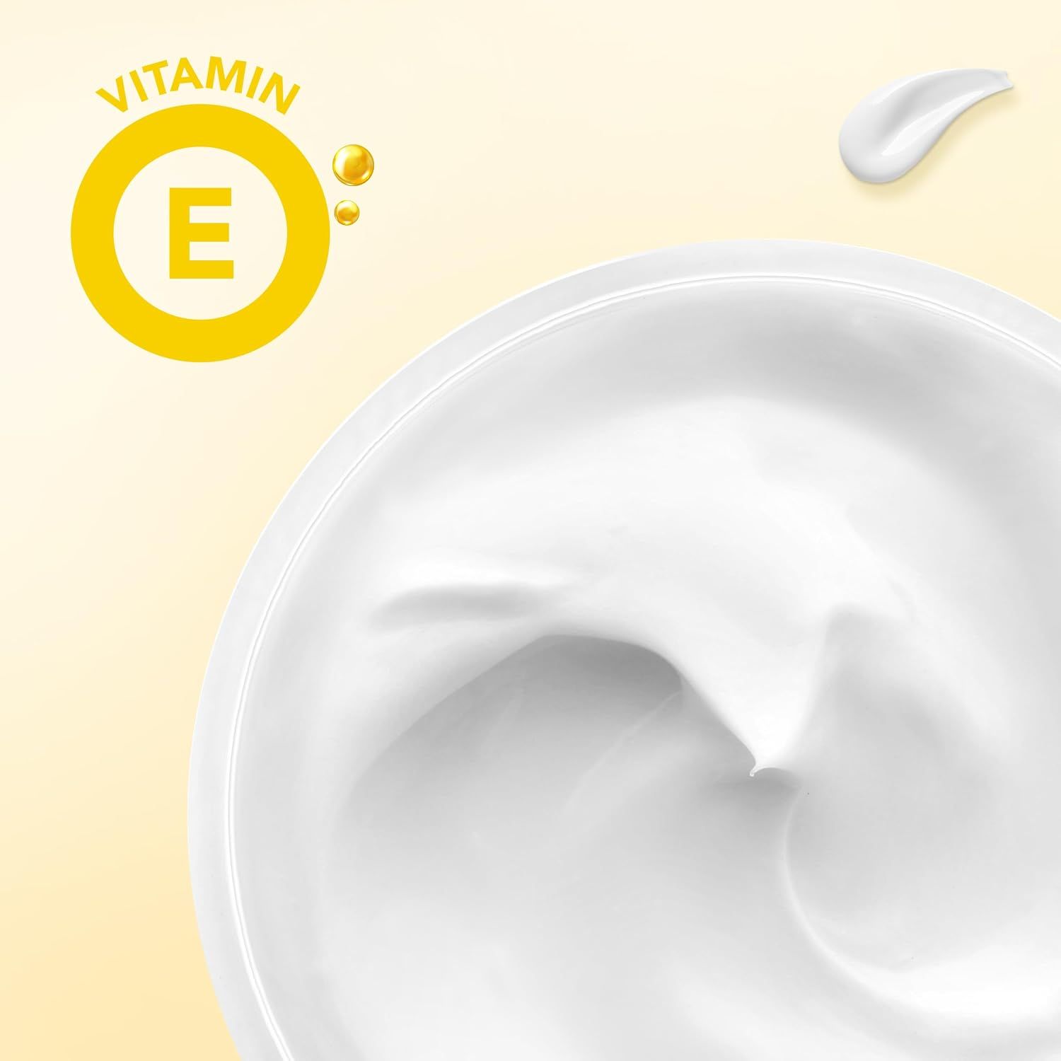 Nahaufnahme einer weißen Creme mit Vitamin E Symbol.